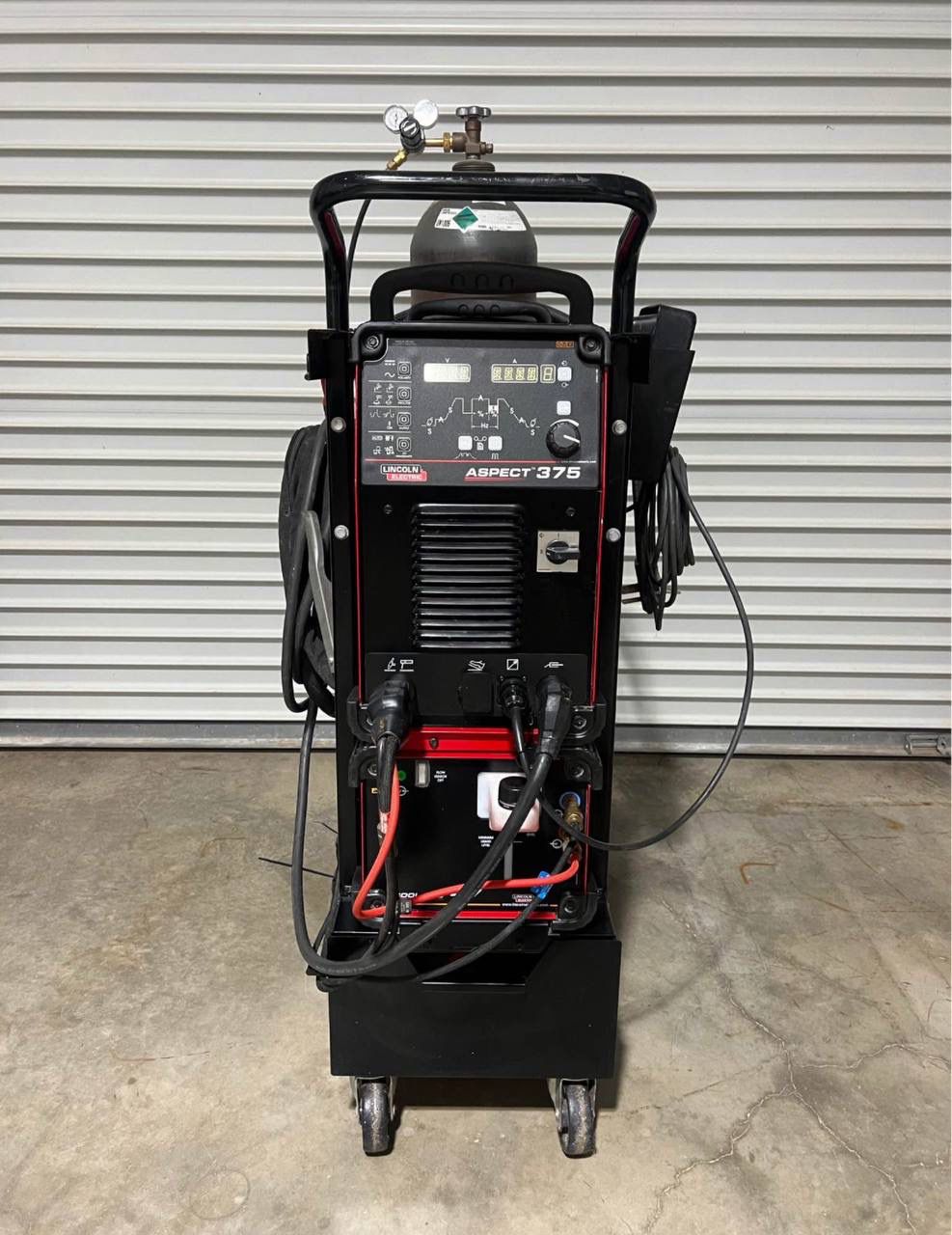 Lincoln Aspect 375 TIG Welder | Multi-Process AC/DC Power Lincoln Aspect 375 multi-process AC/DC TIG and Stick welder unit on a white background.