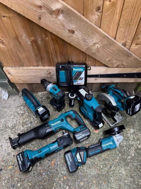 makita 40v max kit tools setConstruction professional using the Makita 40V Max XGT impact driver to drive a lag bolt into wood.