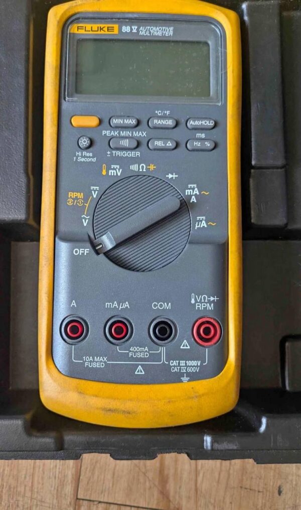 Fluke 88V Automotive Multimeter diagnosing a car engine's electrical system ..fluke 88v automotive multimeter