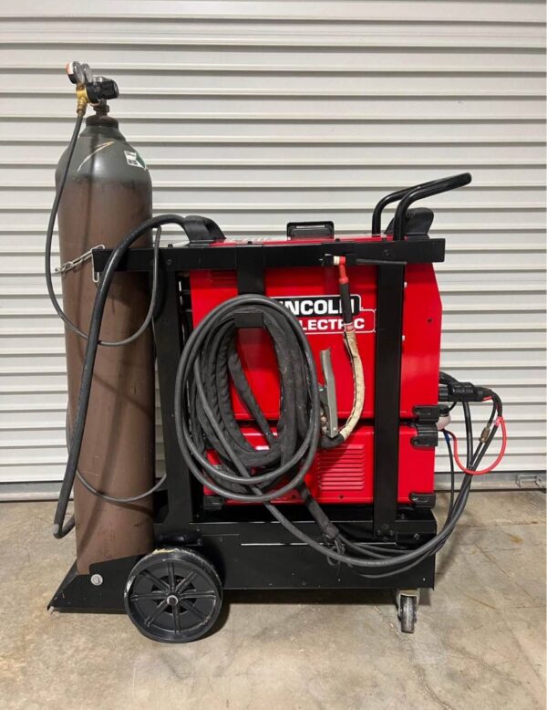 Person using the Lincoln Aspect 375 TIG welder to weld an aluminum part with a bright arc. ..lincoln aspect 375 lincoln aspect 375 tig welder