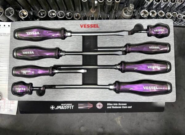 Vessel Iridescent Limited Edition Screwdriver with rainbow PVD coating and black Megadora ball grip handle on a workbench.vessel iridescent limited screw drivers